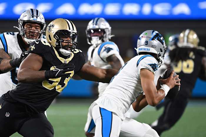 Carolina Panthers quarterback Bryce Young (9) runs as New Orleans Saints defensive tackle Nathan Shepherd (93) pursues. Mandatory Credit: Bob Donnan-USA TODAY Sports